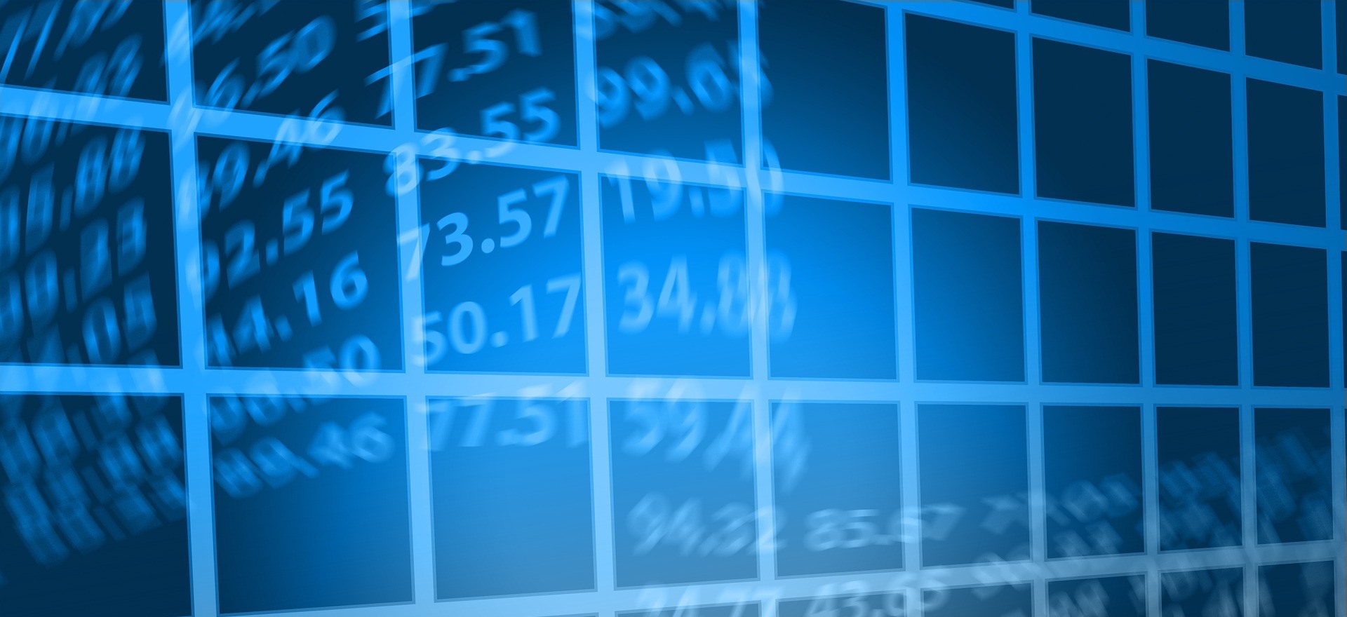 Financial charts and trading analysis on multiple screens